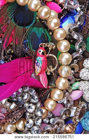 Fashion jewelrys. Fashion jewels as background. Jewelery texture. A lot of Jewells in texture. Jewellery background. Beautiful jewels pattern. Necklace earrings bracelet. Studio photo texture photography. Parrot bijou.