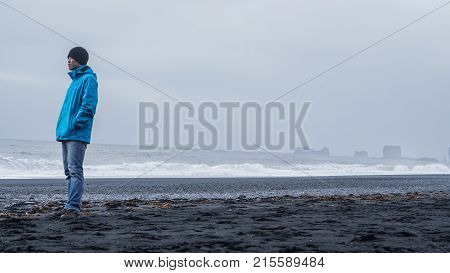 Asina Advanture Man  At Iceland Black Beach With Copy Space