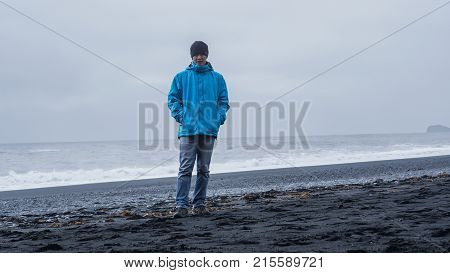 Asina Advanture Man  At Iceland Black Beach With Copy Space