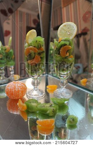 beautiful colorful appetzing fresh fruits in wine crystal glass prepare for cocktail mix