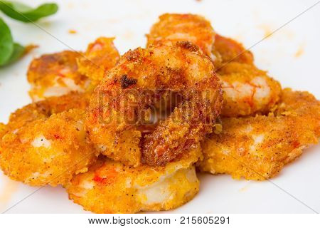 Fried prawns on a white background. Prawns fried in breading close-up.