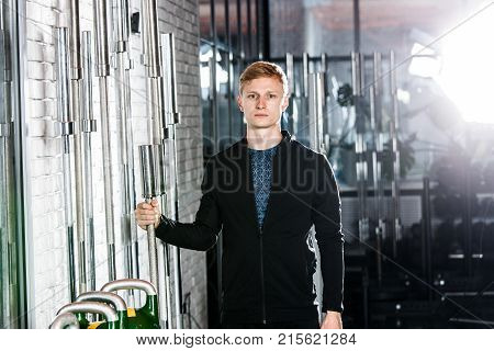 The Guy Is Posing In The Gym