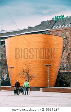 Helsinki, Finland - December 7, 2016: People Walking Near Kamppi Chapel Also Known As Chapel Of Silence Located On Narinkka Square. Chapel Is Operated By Helsinki Parish Union And Social Services Department Of Helsinki