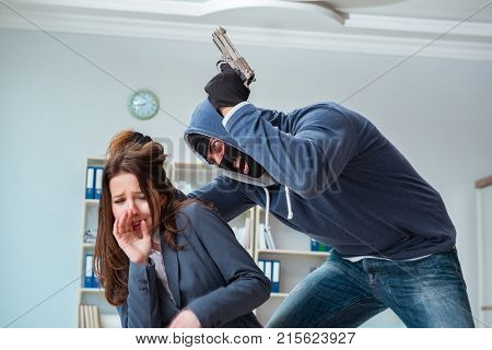 Criminal taking businesswoman as hostage in office