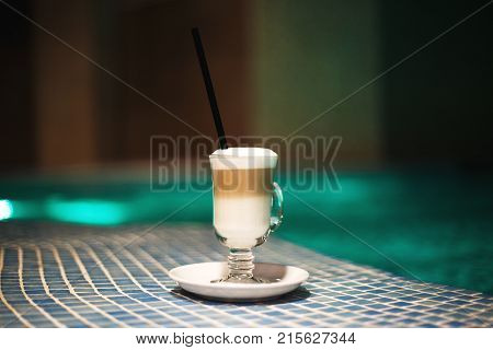A Cup Of Coffee On The Side Of The Pool. Rest In The Spa Center
