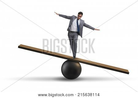 Businessman balancing on seesaw in uncertainty concept