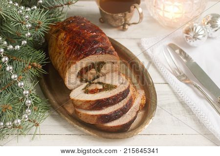 Baked Pork Roll Stuffed With Chard And Sundried Tomatoes Served With Sauce In Christmas Or New Year'
