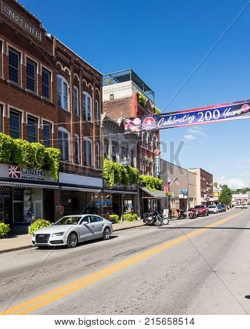 BUCHANNON, WEST VIRGINIA - AUGUST 13, 2016: Flags fly by bicentennial banner across Main Street in Buckhannon West Virginia