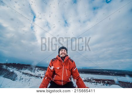Snowboarder In A Black Helmet Riding On A Snowy Track.