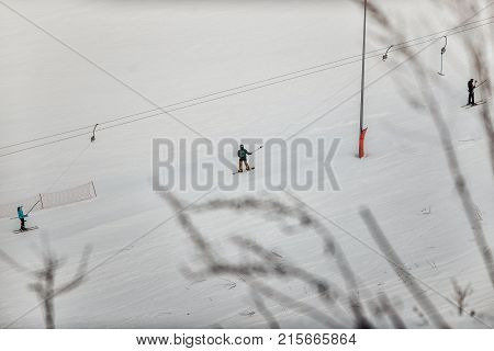 Snowboarder In A Black Helmet Riding On A Snowy Track.