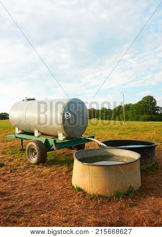 Water trough for drinking for cows cattle in the field Franche Comte France.
