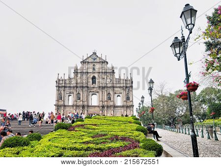Macao China - March 8 2016: People at Ruins of St Paul Church in Historical old city center in Macao China. People on the background