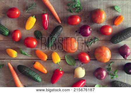 Fresh vegetables on a wooden background. Top view