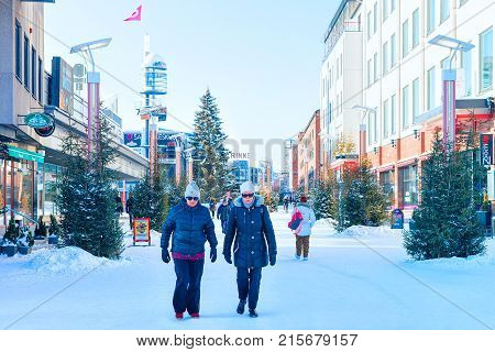 Senior People Passing By Lordi Square In Winter Rovaniemi