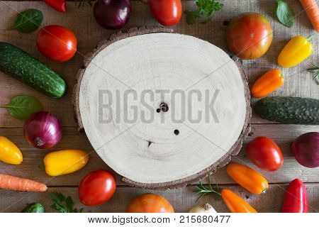 Fresh vegetables on a wooden background. Top view