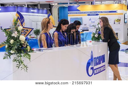 St. Petersburg, Russia - 3 October, Girls standistas behind the counter, 3 October, 2017.
Young girls and women at the St. Petersburg gas forum.