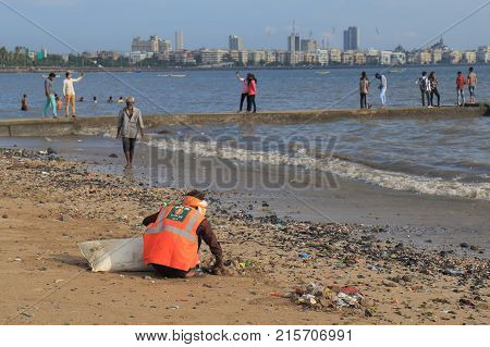 Mumbai India - October 12, 2017: Unidentified Cleaner Cleans Chowpatty Beach In Downtown Mumbai.