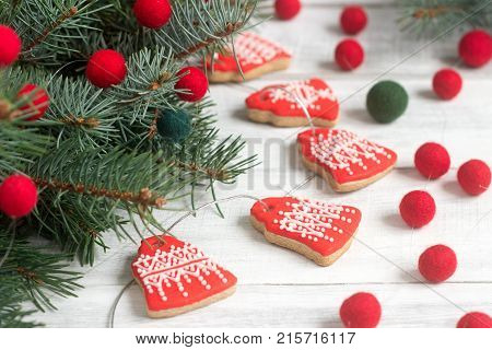 Gingerbread Bells, A Garland Of Faded Beads And Spruce Branches On A Light Background - A Christmas