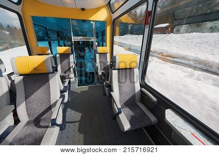 ZERMATT, SWITZERLAND - MARCH 03, 2009: Interior of the second class car in the train of Matterhorn Gotthard Bahn between Brig and Zermatt.