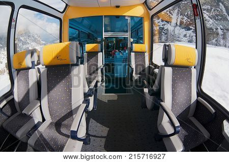 ZERMATT, SWITZERLAND - MARCH 03, 2009: Interior of the second class panoramic car in the train of Matterhorn Gotthard Bahn between Brig and Zermatt.