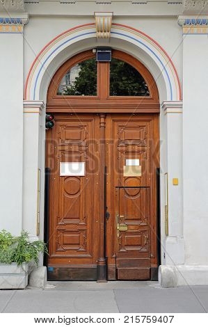 Wooden Arch Door at Building Entrance Vienna