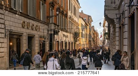 Rome italy february 2017: people walking along the elegant shopping avenue Via di Condotti in Rome Italy