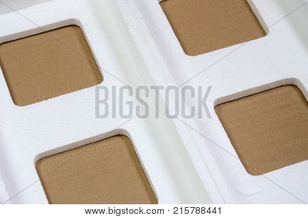 Background Image With Beige Cardboard Paper And Styrofoam Boxes Disgarded As Rubbish. The Concept Of