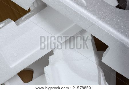 Background Image With Beige Cardboard Paper And Styrofoam Boxes Disgarded As Rubbish. The Concept Of