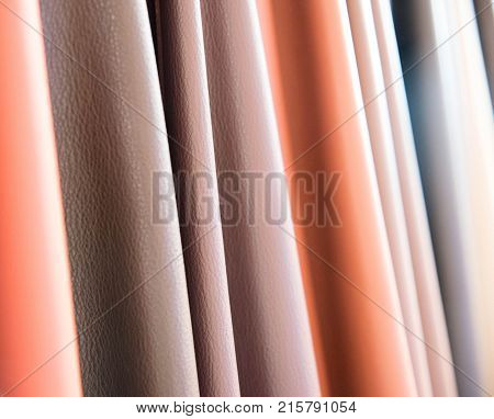 Color palette sample of leather material as a background.