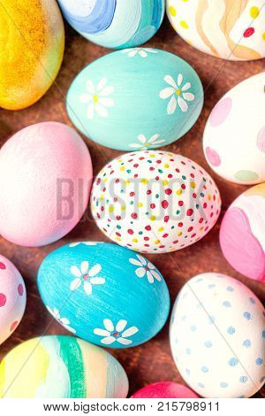 Colorful Easter Eggs with copy space. Easter background with handmade painted eggs. Top view