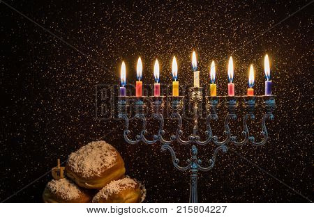 Image of the Hanukkah Jewish holiday with a menorah and burning candles