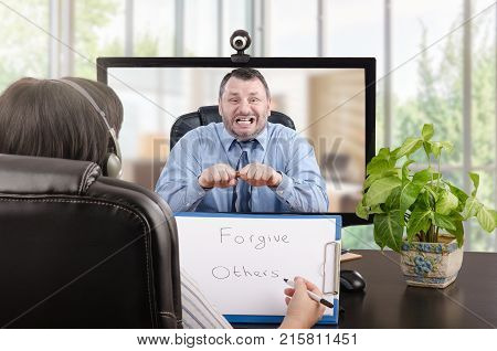 E-health psychologist teaches angry businessman effective strategy for controlling his temper during video chat
