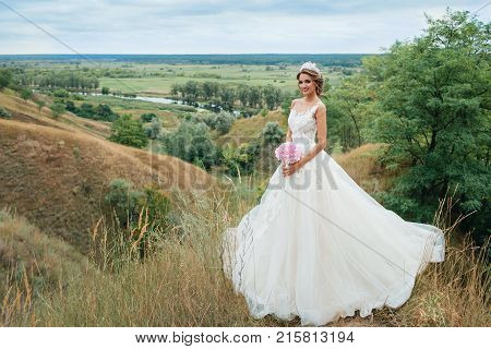 Beautiful Young Bride Girl Smiling, Standing In Wedding Dress.