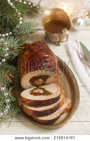 Baked Pork Roll Stuffed With Chard And Sundried Tomatoes Served With Sauce In Christmas Or New Year'
