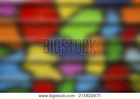 Blurred defocused bright colored metal profiled background. Colored abstract paint stains texture