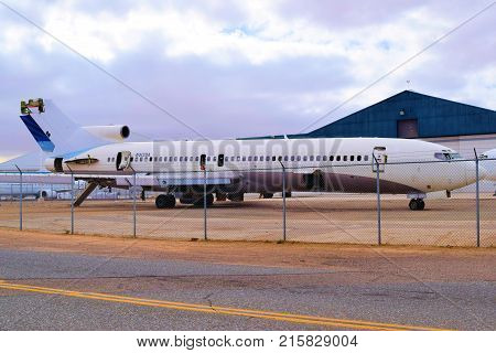 November 27, 2017 in Victorville, CA:  Vintage airliner aircraft stored and scrapped for parts taken in the Victorville Airport Airplane Boneyard in Victorville, CA where airlines can store their older planes to be resold or scrapped for parts