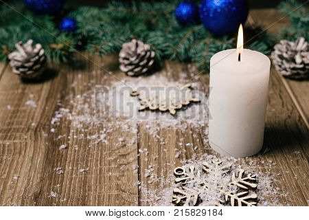 Christmas Candle On A Wooden Background