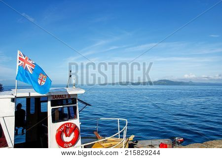 Taveuni, Fiji - November 29: National Flag Of Fiji Flying On A Small Boat Docked At Korean Wharf On