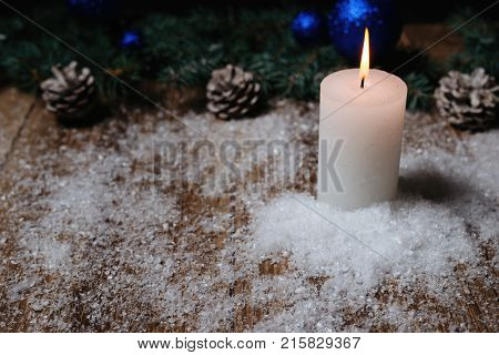 Christmas Candle On A Wooden Background