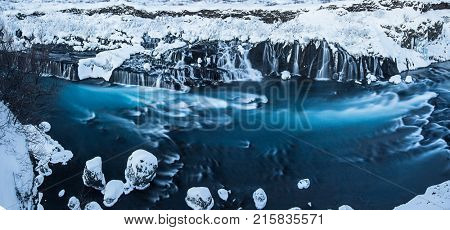 Hraunfossar waterfall in winter. One of the most popular waterfall in Iceland, Europe.