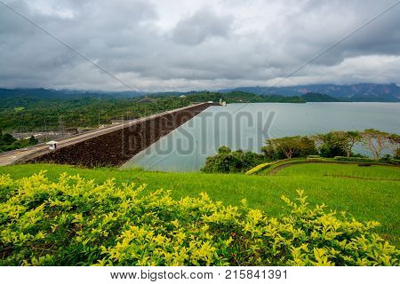 Dam behind a Green Garden with dark cloudy at the Southern of Thailand (Surat Thani)