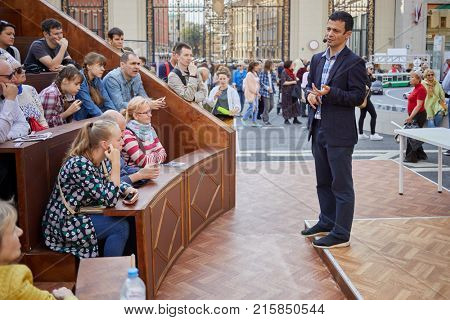 MOSCOW, RUSSIA - SEP 10, 2017: People listen to russian scientist A.Oganov on Tverskaya Street during celebration 870th anniversary of Moscow.