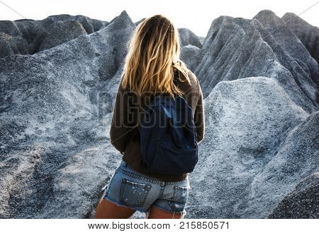 Woman hiking to the top of mountain in nature