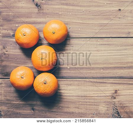 Christmas orange mandarins on the wood background