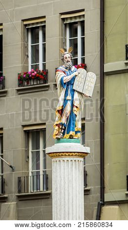 BERN, SWITZERLAND - JUNE 05, 2016: Moses fountain in old town. The figure of Moses holding Ten Commandments.