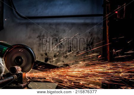 Worker are using electric cutting steel machine background