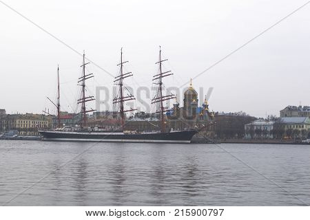 St. Petersburg, Russia - November 4, 2014: Autumn, cloudy evening on Bolshaya Neva. Sailboat 