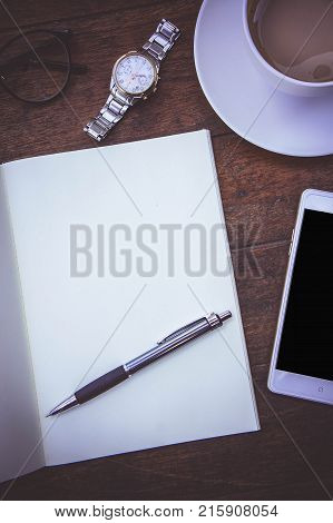 Blank Paper Book On the wood working table Warm coffee Wait for creative time to start papeer blank for text background