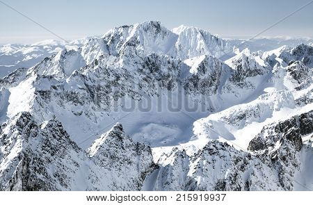 Beautiful snowy peaks in winter. View from peak Lomnicky stit in High Tatras mountains Slovakia