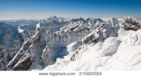 Beautiful snowy peaks in winter. View from peak Lomnicky stit in High Tatras mountains Slovakia